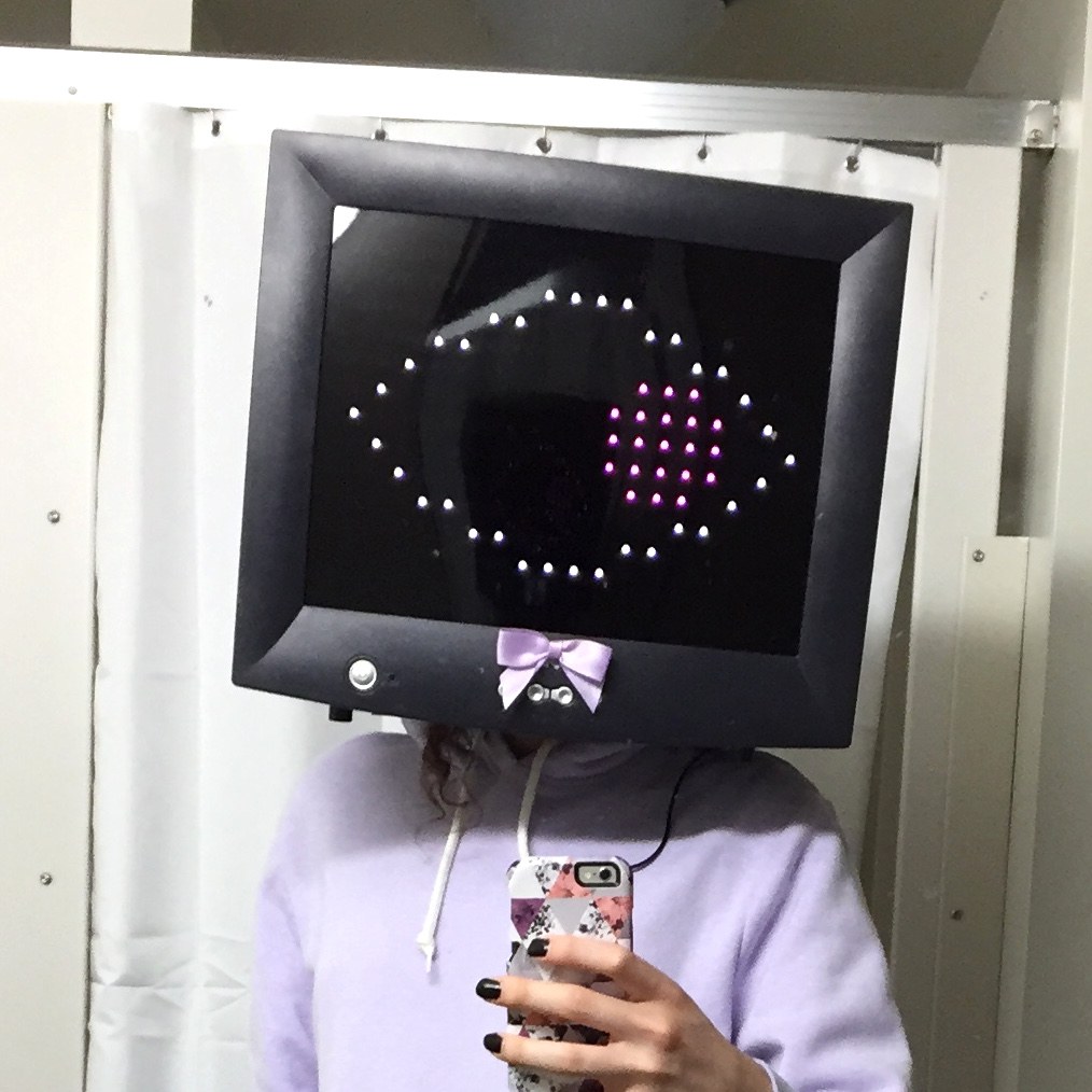 Me in my TV head costume. I'm wearing an old computer monitor on my head, with a cute bow on the front.